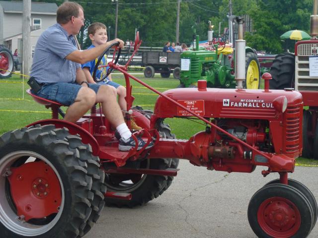 Red Custom-Built Dual-Seat McCormick Farmall Cub Tractor in Monday's parade at the fair
